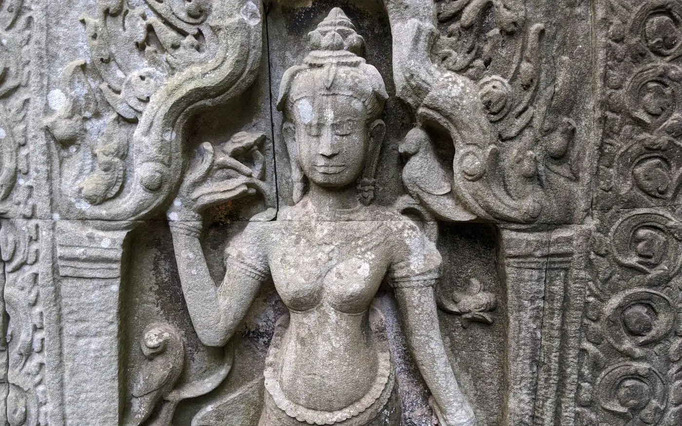 A carved female figure in temple sandstone